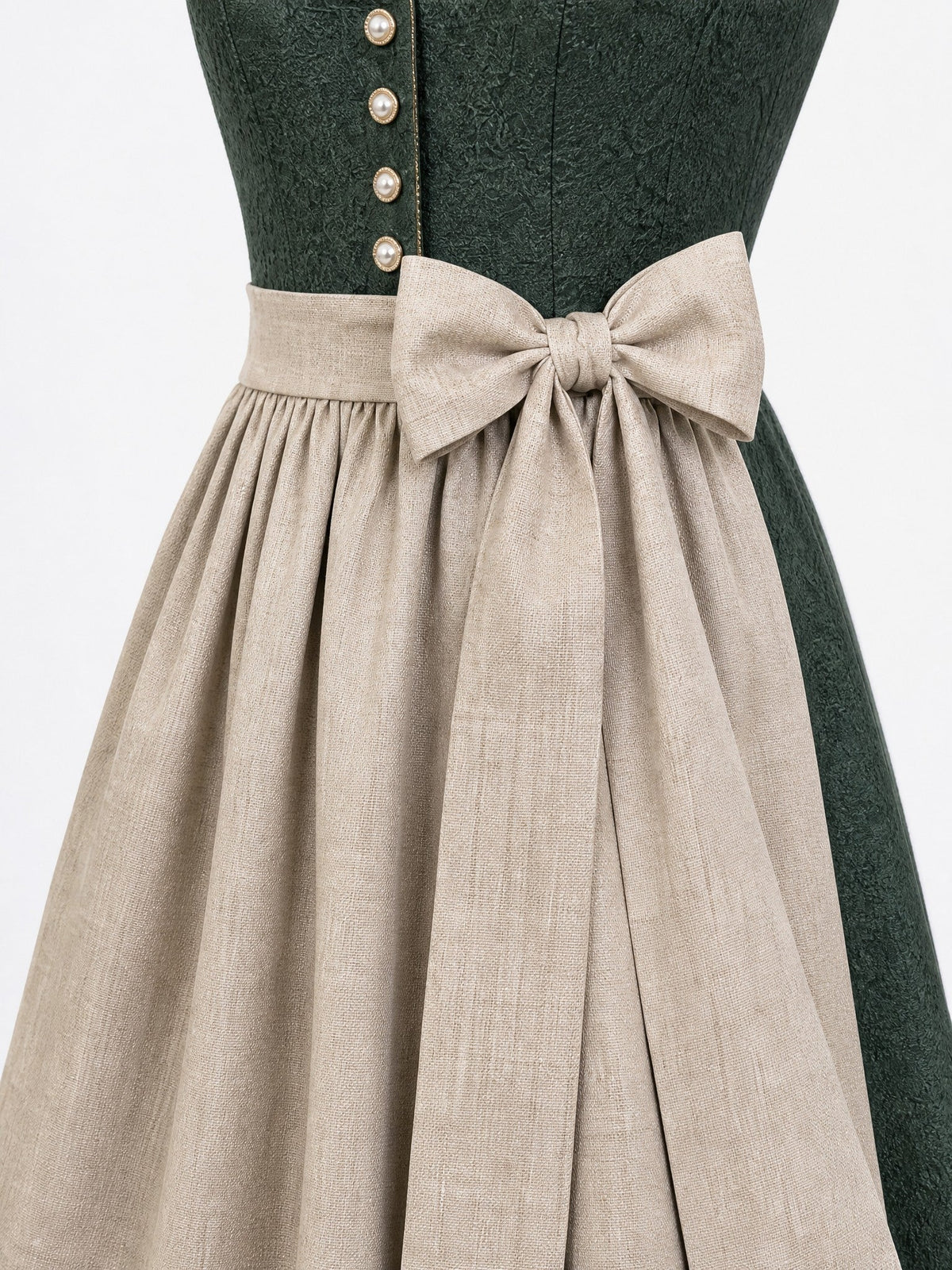 Dirndl Anika in Waldgrün mit Haferbeige Schürze - Detailansicht Taille und Schleife