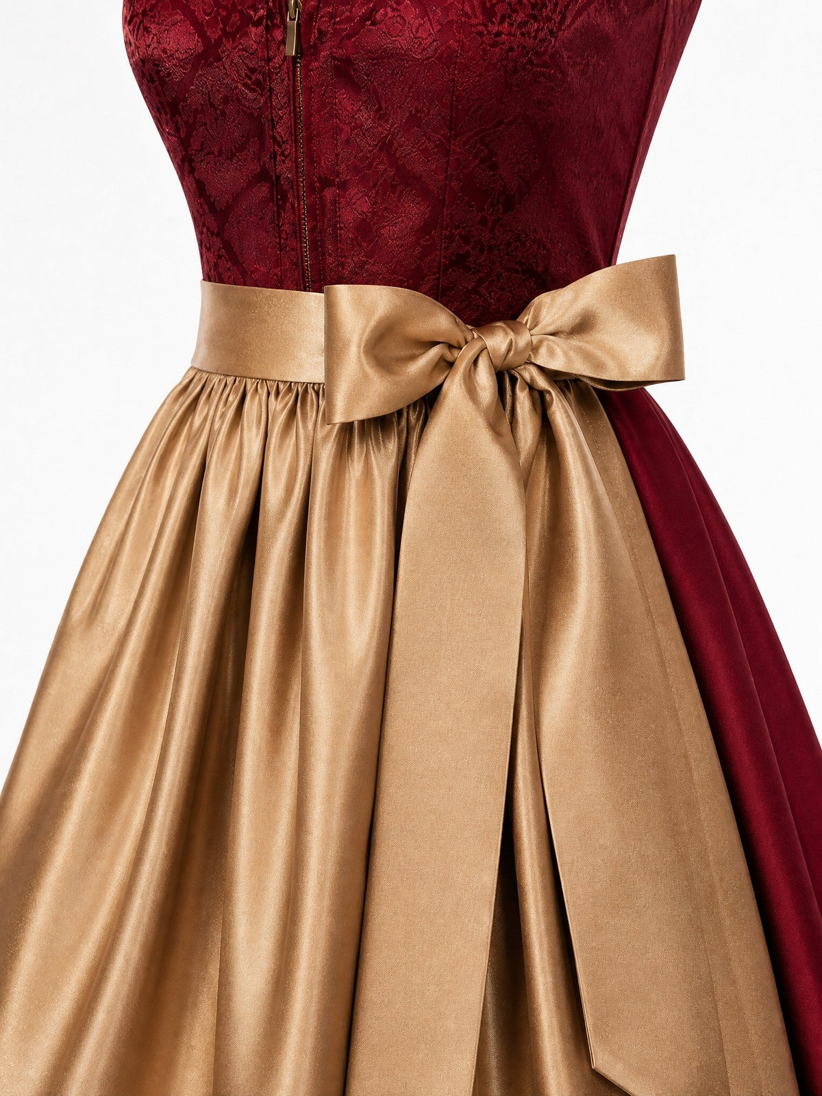 Dirndl Felicia in Cranberryrot mit Antikgold Schürze - Detailansicht Taille und Schleife